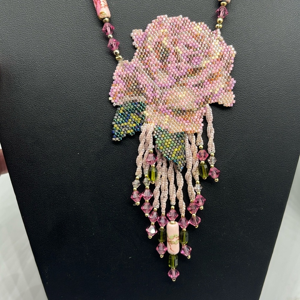 Vintage hand beaded pink and green glass rose necklace Amulet is approx 5.3 inch